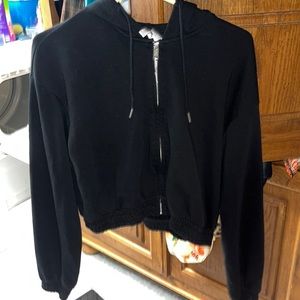 H&M divided, black cropped zip up hoodie. Size medium.